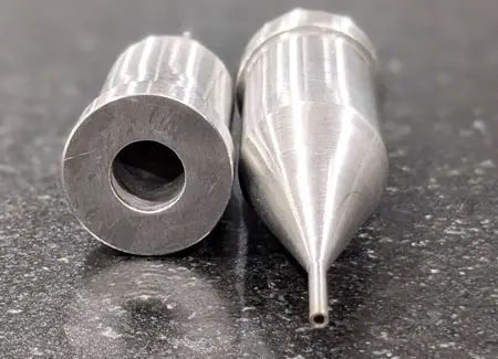 Precision medical component machined from surgical-grade SS316 stainless steel, featuring custom CNC milled surfaces, turned geometries, internal threading, and a tight-tolerance 0.4mm micro-hole executed via EDM electrode processing. 